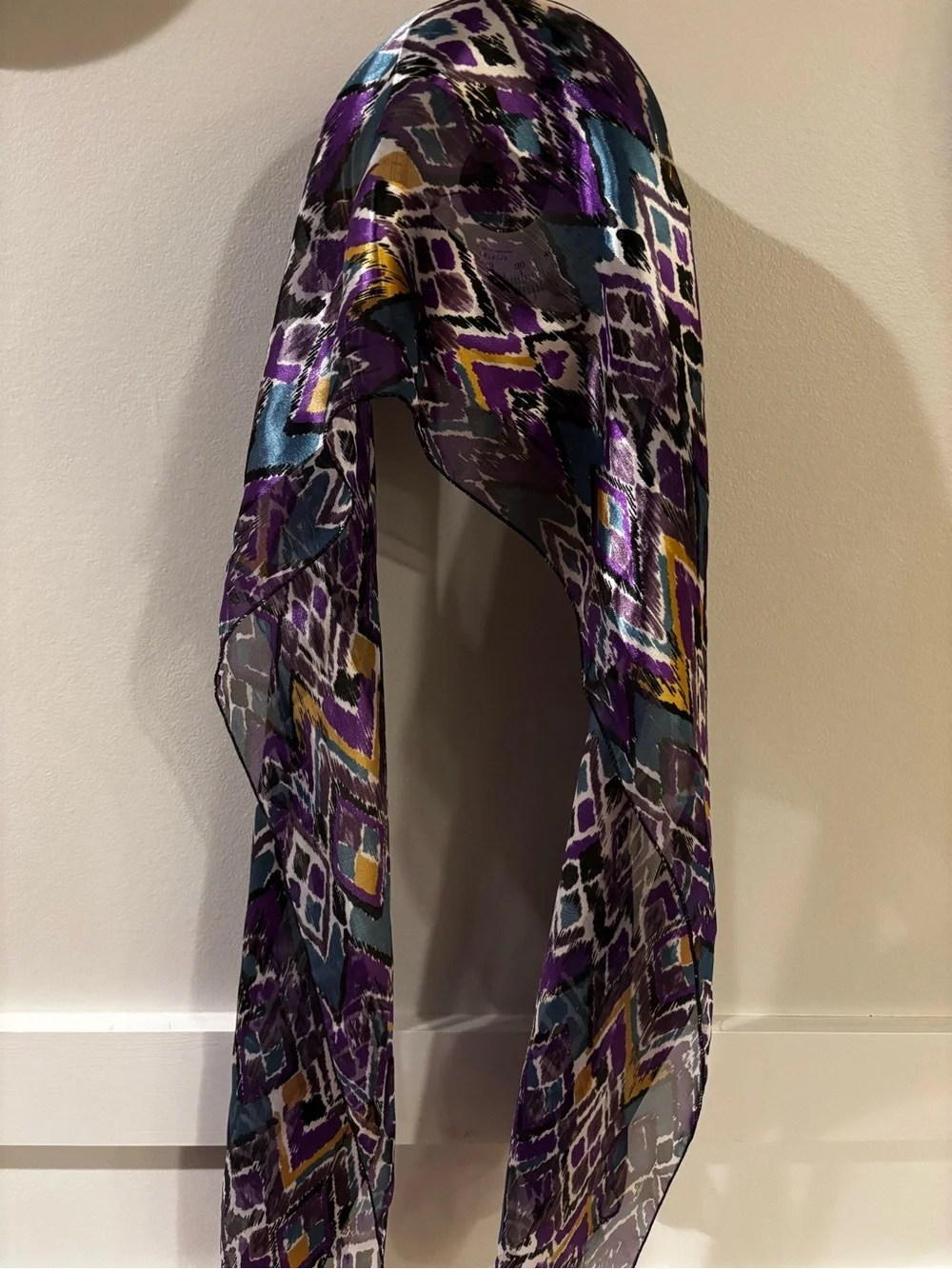 satin scarf featuring a vibrant purple and teal abstract ikat chevron
